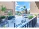 Private balcony with outdoor seating and plants at 90 S Highland Ave # 1115, Tarpon Springs, FL 34689