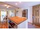 Kitchen features butcher block island, stainless steel appliances, and breakfast bar at 90 S Highland Ave # 1115, Tarpon Springs, FL 34689
