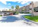 Covered parking area with additional open parking at 90 S Highland Ave # 1115, Tarpon Springs, FL 34689