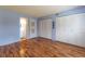Spacious bedroom with wood floors, large closet, and light blue walls at 90 S Highland Ave # 1115, Tarpon Springs, FL 34689