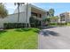 Building exterior with landscaping and parking at 90 S Highland Ave # 1115, Tarpon Springs, FL 34689