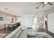 Spacious living room with a light gray sectional sofa and an open floor plan at 339 55Th Ave, St Pete Beach, FL 33706