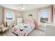 Charming bedroom with butterfly bedding, a pink headboard, and a view at 339 55Th Ave, St Pete Beach, FL 33706