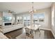 Bright dining room with water views and modern chandelier at 339 55Th Ave, St Pete Beach, FL 33706