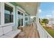 Spacious covered porch with water view, outdoor seating, and tile flooring at 339 55Th Ave, St Pete Beach, FL 33706