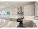 Modern kitchen features stainless steel appliances and marble countertops at 339 55Th Ave, St Pete Beach, FL 33706
