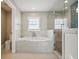 Bathroom with a large soaking tub and walk-in shower at 339 55Th Ave, St Pete Beach, FL 33706
