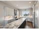 Modern kitchen with marble countertops, stainless steel appliances, and ample cabinetry at 339 55Th Ave, St Pete Beach, FL 33706