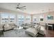 Living room with water view, sectional sofa and access to balcony at 339 55Th Ave, St Pete Beach, FL 33706
