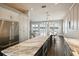 Open concept kitchen with marble island, stainless steel appliances, and water views at 339 55Th Ave, St Pete Beach, FL 33706