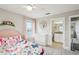 Bedroom with butterfly bedding, a white dresser, and access to a bathroom at 339 55Th Ave, St Pete Beach, FL 33706