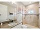 Clean bathroom with a walk-in shower, tile accents and a granite countertop at 339 55Th Ave, St Pete Beach, FL 33706