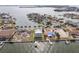 Aerial view of waterfront homes and properties with boat slips at 339 55Th Ave, St Pete Beach, FL 33706