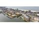 Aerial view of waterfront condos with a tennis court and pool at 339 55Th Ave, St Pete Beach, FL 33706