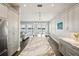 Open concept kitchen boasts a large marble island and water views at 339 55Th Ave, St Pete Beach, FL 33706