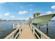 Wooden dock and boat lift on calm water at 339 55Th Ave, St Pete Beach, FL 33706