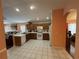 Bright kitchen with white appliances and wood cabinets at 6812 Aramon Ct, Wesley Chapel, FL 33545