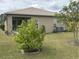 Covered patio with lush landscaping and AC unit at 6812 Aramon Ct, Wesley Chapel, FL 33545