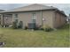 House exterior showcasing a well-maintained lawn and AC unit at 6812 Aramon Ct, Wesley Chapel, FL 33545