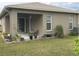 Back patio with seating area, perfect for relaxing at 6812 Aramon Ct, Wesley Chapel, FL 33545