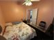 Bedroom with floral bedding and ceiling fan at 6812 Aramon Ct, Wesley Chapel, FL 33545