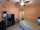 Bedroom with double bed, closet, and ceiling fan at 6812 Aramon Ct, Wesley Chapel, FL 33545