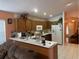 Kitchen with wood cabinets and a breakfast bar at 6812 Aramon Ct, Wesley Chapel, FL 33545