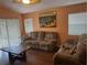Spacious living room with neutral decor and large windows at 6812 Aramon Ct, Wesley Chapel, FL 33545