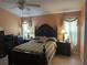 Main bedroom with a large bed and ample natural light at 6812 Aramon Ct, Wesley Chapel, FL 33545