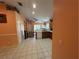 Kitchen with view into living room, hardwood floors at 6812 Aramon Ct, Wesley Chapel, FL 33545