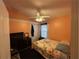 Bedroom with floral bedding, ceiling fan, and closet at 6812 Aramon Ct, Wesley Chapel, FL 33545