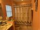 Bathroom with shower/tub combo, toilet and vanity at 6812 Aramon Ct, Wesley Chapel, FL 33545
