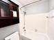 Bathroom with shower/tub combo and wood cabinet at 15519 Morning Dr, Lutz, FL 33559