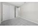 Spacious bedroom with grey carpet, double doors, and neutral walls at 3108 Winding Creek Trl, North Port, FL 34289