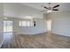 Spacious living room with high ceilings and wood-look floors at 3776 Junction St, North Port, FL 34288