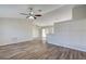 Open living room with wood-look floors and high ceilings at 3776 Junction St, North Port, FL 34288