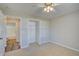 Bedroom with ceiling fan, access to bathroom and closet at 3776 Junction St, North Port, FL 34288