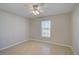 Bedroom with ceiling fan, window with blinds, and tile flooring at 3776 Junction St, North Port, FL 34288
