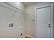 Laundry room with shelving and built-in space for washer and dryer at 3776 Junction St, North Port, FL 34288