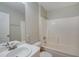 Simple bathroom with a white vanity and a shower/tub at 3776 Junction St, North Port, FL 34288