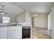 Open concept kitchen and dining area with wood-look flooring at 3776 Junction St, North Port, FL 34288