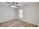 Bright bedroom with ceiling fan and wood-look flooring at 3776 Junction St, North Port, FL 34288
