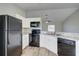 Modern kitchen with black appliances at 3776 Junction St, North Port, FL 34288
