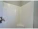 Clean shower with white tile and corner seat at 3776 Junction St, North Port, FL 34288