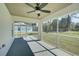 Screened-in porch with ceiling fan, great for relaxing outdoors at 3776 Junction St, North Port, FL 34288