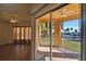 Bright living room with hardwood floors and access to a private balcony at 4309 Bayside Village Dr # 101, Tampa, FL 33615