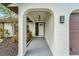 Inviting entryway with arched walkway leading to the front door at 4501 Harrington St, Port Charlotte, FL 33948