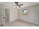 Well-lit bedroom with ceiling fan and built-in closet at 4501 Harrington St, Port Charlotte, FL 33948