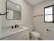 Clean bathroom with a white vanity, marble countertop, and modern fixtures at 4501 Harrington St, Port Charlotte, FL 33948