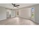 Spacious bedroom with barn door, large window and wood-look floors at 4501 Harrington St, Port Charlotte, FL 33948